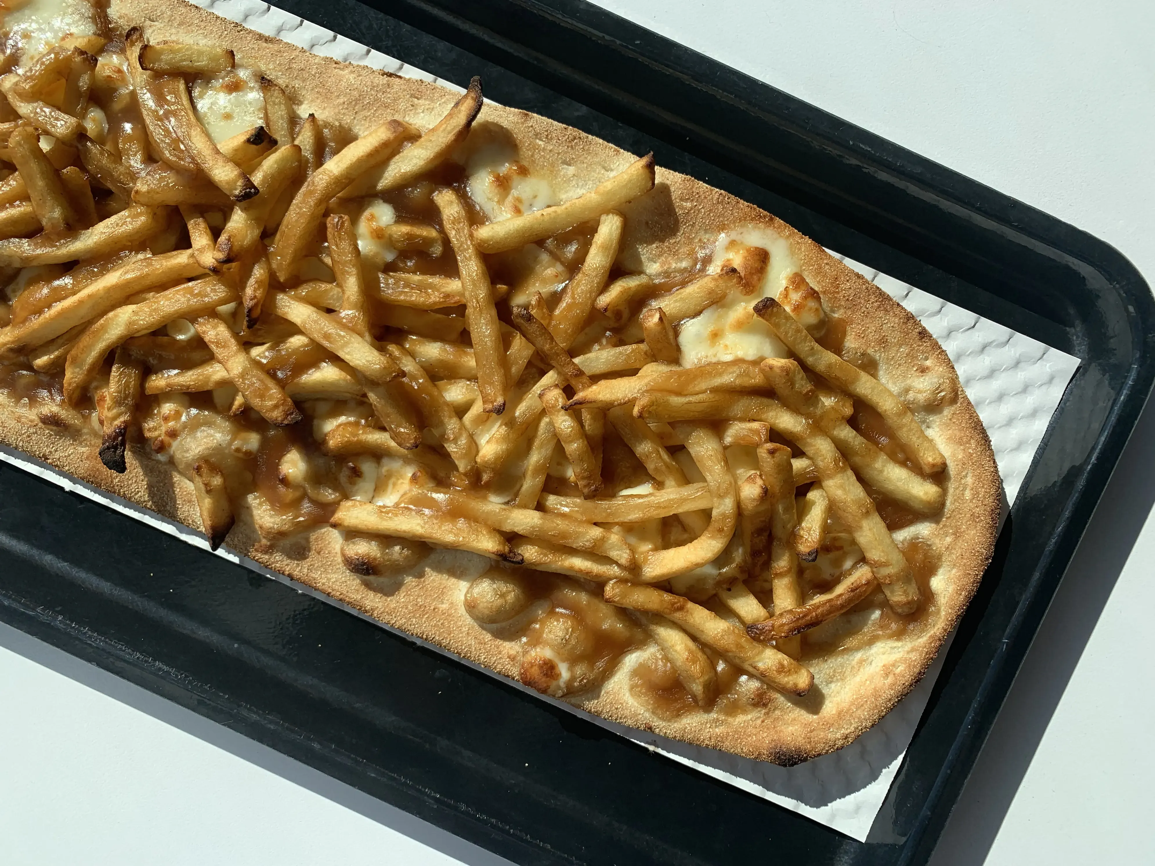 Original Poutizza - signature pizza with gravy fries and cheese curds